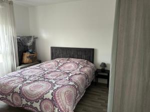 Postel nebo postele na pokoji v ubytování Agréable 2 pièces avec balcon et Parking transports by immo kit bnb