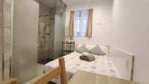 Ein Bett oder Betten in einem Zimmer der Unterkunft Dormir en Cádiz