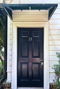 una porta nera con il numero sopra. di Elegant Guest Studio in Upscale Community a Covington