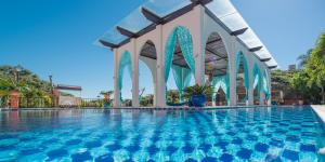 a swimming pool at a resort at Pedra da Laguna Boutique Hotel SPA in Búzios