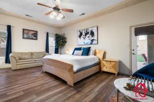 a bedroom with a bed and a couch at Desert Hills - An Irvie Home in Albuquerque
