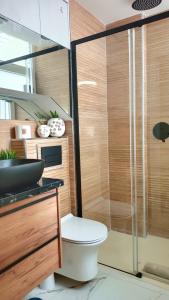 a bathroom with a toilet and a glass shower at ESTEPONA RADA BEACH ABC APARTMENTS & ESTUDIOS A in Estepona +34 photos