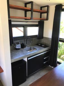 A kitchen or kitchenette at Barong EcoVilla