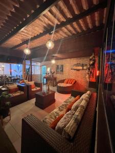 a large living room with a couch in a room at Pousada da Leide in Fernando de Noronha