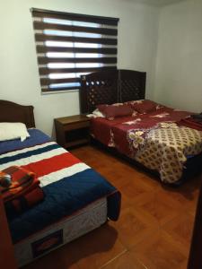 Cama o camas de una habitación en Casa de veraneo Olmué