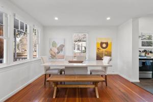 a white dining room with a table and chairs at Downtown Napa HOT TUB Retreat - 3 Bed l 2 bath in Napa