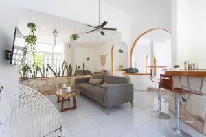 a living room with a couch and a table at Cancun Family ideal Villa, private pool and garden in Cancún
