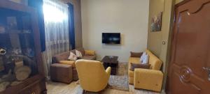 TV a/nebo společenská místnost v ubytování El mansoura Heaven + 3 fotografie