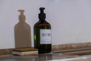 a bottle of glass soap sitting on a counter at MONOLOCALE CASENUOVE con GIARDINO in Castiglioncello