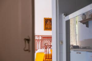 a view of a room with a bed and a window at MONOLOCALE CASENUOVE con GIARDINO in Castiglioncello
