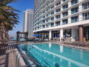 a swimming pool in front of a building at Luxury Ocean Escape by Cielo Stays in Hollywood