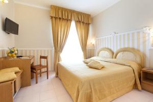 Postel nebo postele na pokoji v ubytování Hotel Sant'Agata