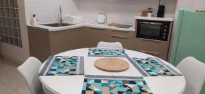 a kitchen with a table with a hat on it at Heraklion City Center Apartment in Heraklio