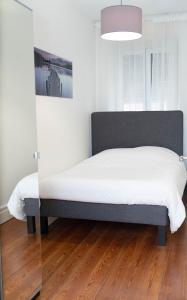 Llit o llits en una habitació de Beau T2 quartier Contades