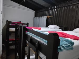 a group of four beds in a room at Calm hostel in Antigua Guatemala +15 photos