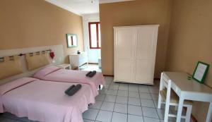 Postel nebo postele na pokoji v ubytování Estoril Hotel - Apartments