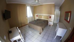Postel nebo postele na pokoji v ubytování Estoril Hotel - Apartments