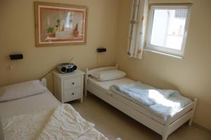 Postel nebo postele na pokoji v ubytování Strandzauber