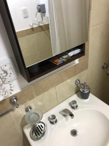 a bathroom sink with a mirror above it at Apartamento El Hornero in San Rafael