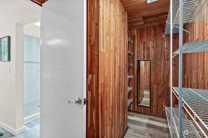 a room with wood paneled walls and a spiral staircase at Secluded Sanctuary With a View of The Puget Sound in Gig Harbor