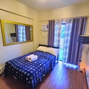 Кровать или кровати в номере Two Bedroom Fully Furnished 70sqm-Condo in Mirea Residences Pasig