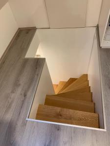a room with wooden stairs in a house at Haus CM in Nüziders