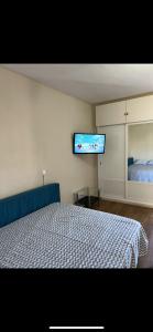 a bedroom with a bed and a flat screen tv at Jupiter Sea View in Benalmádena +12 photos