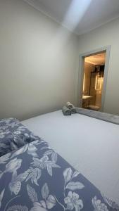 En eller flere senge i et værelse på Refúgio Costeiro