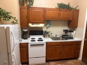 a kitchen with a white stove and a sink at Dover Historic Building 1Bed w/Hot Tub 1st floor in Dover