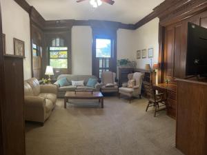 a living room with a couch and a tv at Dover Historic Building 1Bed w/Hot Tub 1st floor in Dover