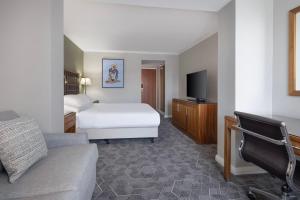 a hotel room with a bed and a tv at Delta Hotels by Marriott Edinburgh in Edinburgh