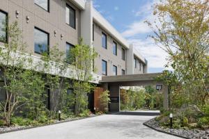 an external view of a building with a driveway at Fairfield by Marriott Fukuoka Ukiha in Ukiha