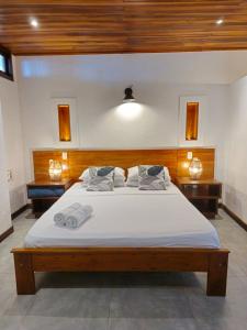 Makao Beach Hotel客房内的一张或多张床位