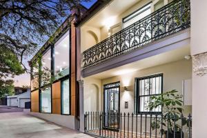 an exterior view of a house with a balcony at Woollahra house beautiful 3 bedroom terrace in Sydney