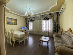 a living room with a couch and a table at Large 5 bedroom VIP Villa 2 in Yerevan