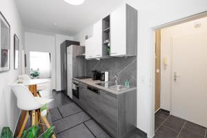 Кухня или мини-кухня в einzigartiges Apar. Prater/Messe
