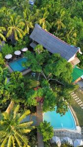 an aerial view of a resort with a swimming pool at The Hillside Resort Siargao in General Luna