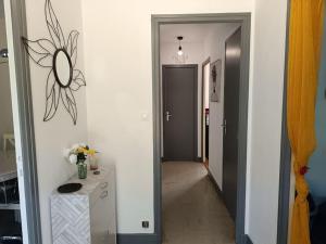 a hallway with a hallway leading to a room at Maison entière 65 m² 5 personnes + jardin au calme in Saint-Aulaire