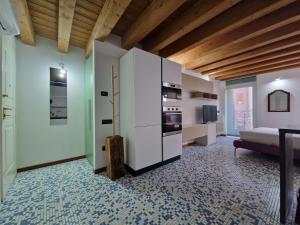 a large living room with a bed and a couch at Appartamento con terrazzo in Udine