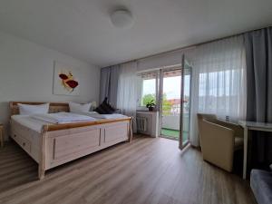 Postel nebo postele na pokoji v ubytování Apart Hotel Freiburg