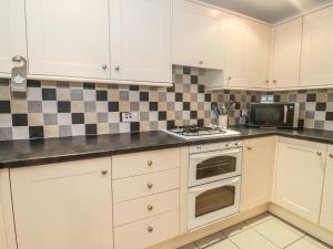 Dapur atau dapur kecil di Ty Potiwr