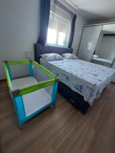 Postel nebo postele na pokoji v ubytování Vila VIKS
