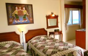 Postel nebo postele na pokoji v ubytování Fulay Hotel