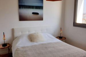 LE SOLAVUE 150 M2 VUE EXCEPTIONNELLE SUR LE LAC客房内的一张或多张床位