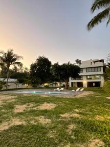 a house with a swimming pool in front of it at Beach spot in Riambel