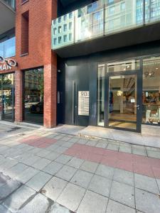 a store front of a building with a sign on the door at européenne union résidence in Brussels