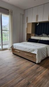 A bed or beds in a room at Uber Chic Boutique Stay In City Center