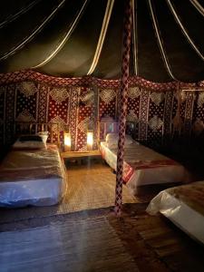a room with two beds in a tent at Nassimah in Giza