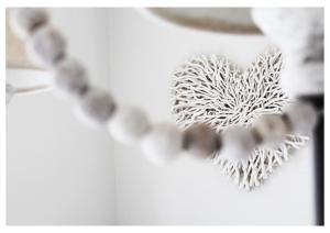 a close up of a heart shaped decoration with beads at Seafront Apartment with Stunning Views in Cleethorpes