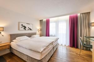 Voodi või voodid majutusasutuse Hotel Garni Sursilva toas